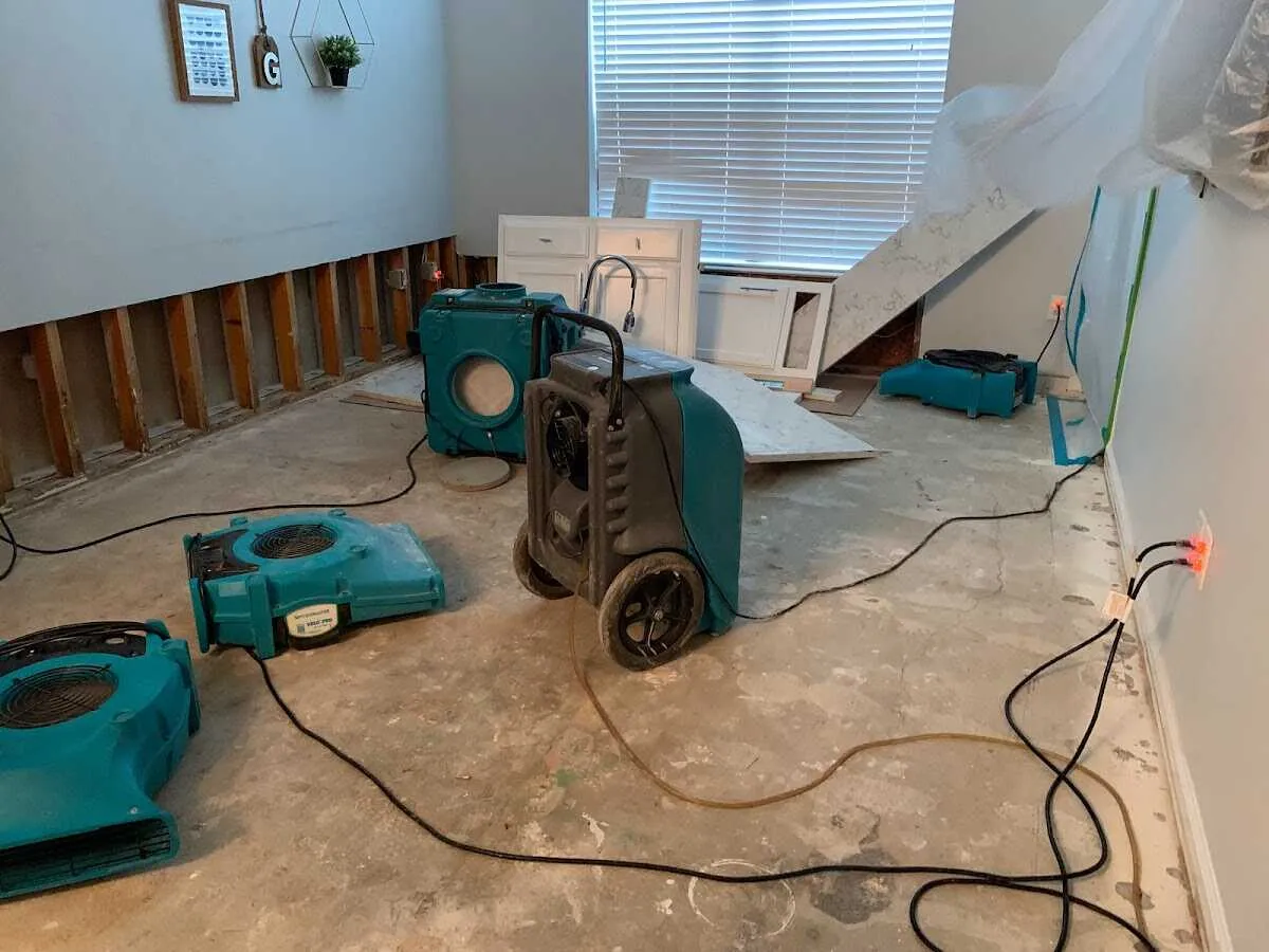 Dehumidifier in flood-cut room for Water Damage Restoration in Holiday